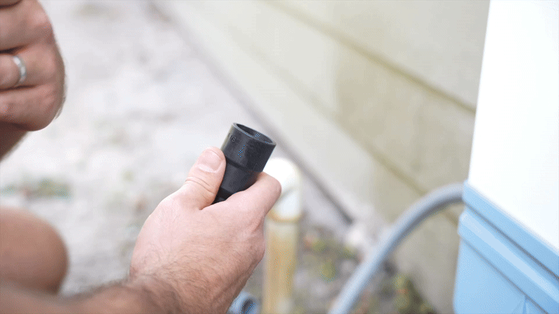 Unclog suction test demonstrating material being pulled through a condensate drain line